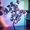 Albero luminoso da tavolo con fiori di rosa